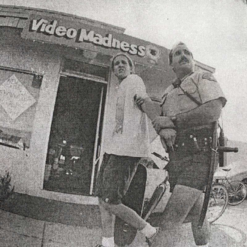 Kit being arrested by a daisy duke wearing foot patrol officer